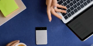 IFA 2025: The Slim, Smart, and Sharp New Plaud Note Pro a person's hands holding a cup of coffee and a laptop. Plaud Note Pro. IFA 2025 news. {Tech} for Travel. https://techfortravel.co.uk
