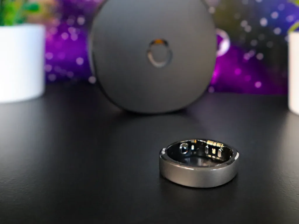 a round silver ring on a black surface. RingConn Gen 2 Smart Ring Review. {Tech} for Travel. https://techfortravel.co.uk