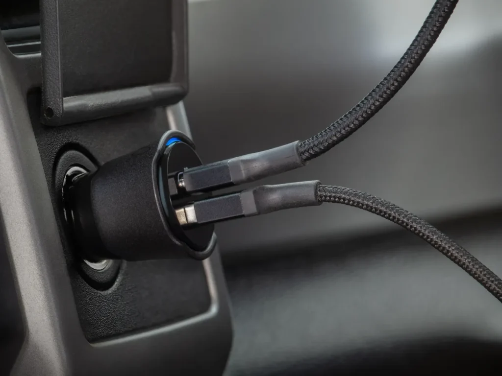 Scosche FoundIT car charger – {Tech} for Travel a close up of a plug in a car. Scosche FoundIT car charger . {Tech} for Travel. https://techfortravel.co.uk