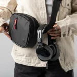 a person holding a bag with headphones around their waist. Skullcandy Aviator 900 Headphones. {Tech} for Travel. https://techfortravel.co.uk