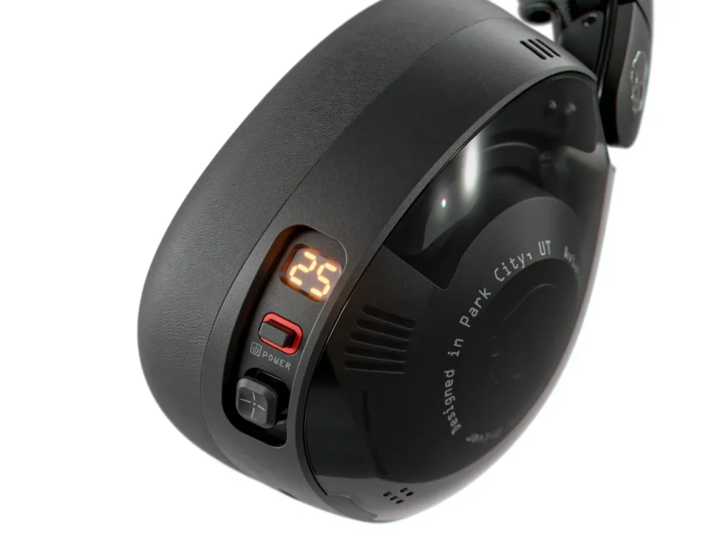 a black round object with a light on it. Skullcandy Aviator 900 Headphones. {Tech} for Travel. https://techfortravel.co.uk