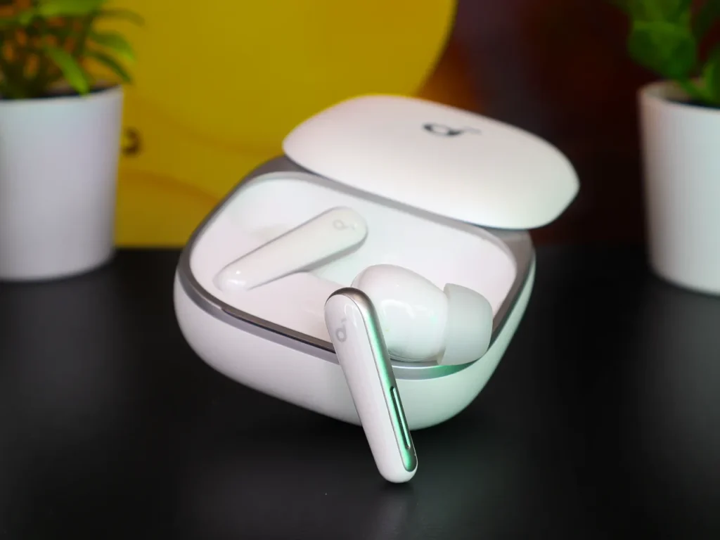 Soundcore Liberty 5 Review – {Tech} for Travel a white wireless earbuds in a case. Soundcore Liberty 5 review. {Tech} for Travel. https://techfortravel.co.uk