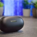 TOZO Golden X1 Review: Small Earbuds, Huge Sound Performance a black oval object on a table. TOZO Golden X1 Earbuds Review. {Tech} for Travel. https://techfortravel.co.uk