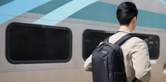 The HyperPack Tech Backpack offers security and style a man with a backpack standing next to a train. HyperPack Tech Backpack. {Tech} for Travel. https://techfortravel.co.uk