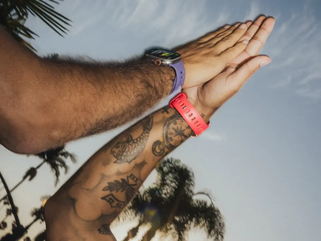 a pair of hands with tattoos and a watch. Nomad Tempo Band. {Tech} for Travel. https://techfortravel.co.uk