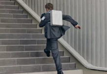 First look at the new RIMOWA Original Backpack a man running up stairs with a briefcase. RIMOWA Original Backpack. {Tech} for Travel. https://techfortravel.co.uk