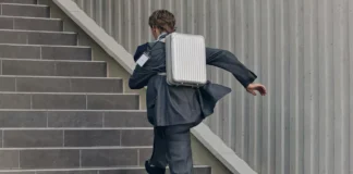 First look at the new RIMOWA Original Backpack a man running up stairs with a briefcase. RIMOWA Original Backpack. {Tech} for Travel. https://techfortravel.co.uk
