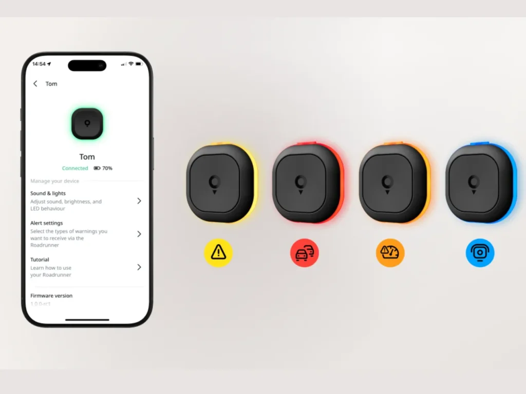 a phone with a screen showing a number of round objects. TomTom app. speed camera warning device. Tom by TomTom. {Tech} for Travel. https://techfortravel.co.uk