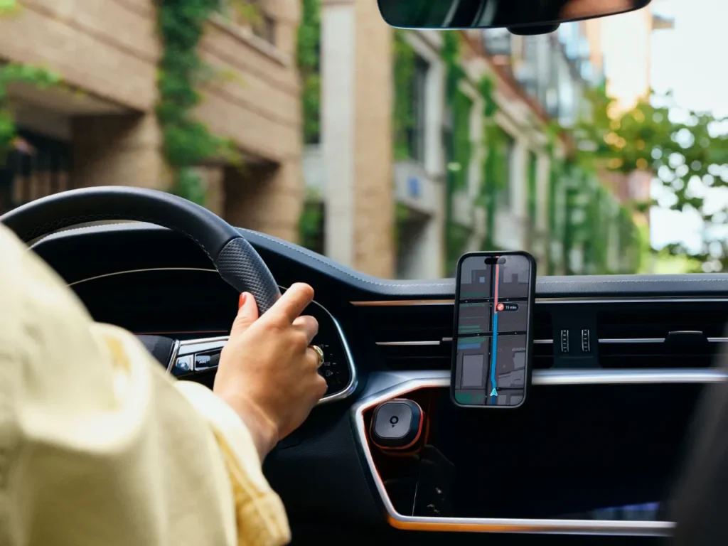 a person driving a car. TomTom app. speed camera warning device. Tom by TomTom. {Tech} for Travel. https://techfortravel.co.uk