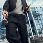 IFA 2025: beyerdynamic Launches AVENTHO 200 ANC Headphones with Headturning Style a person holding a luggage. beyerdynamic AVENTHO 200 ANC Headphones. {Tech} for Travel. https://techfortravel.co.uk