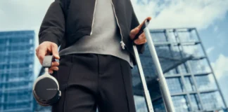 IFA 2025: beyerdynamic Launches AVENTHO 200 ANC Headphones with Headturning Style a person holding a luggage. beyerdynamic AVENTHO 200 ANC Headphones. {Tech} for Travel. https://techfortravel.co.uk