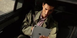 Apple iPad Pro M5 launched with new M5 chip and AI boost a man sitting in a car holding a tablet. Apple iPad Pro M5. {Tech} for Travel. https://techfortravel.co.uk