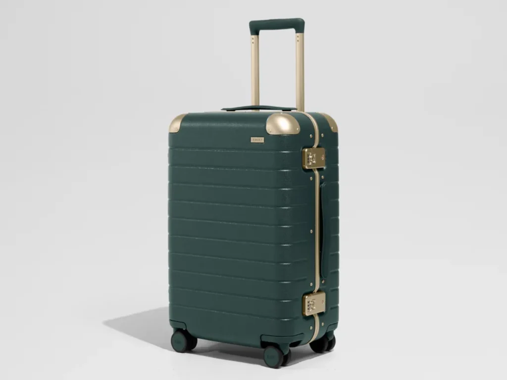 Away Aluminum Collection Ivy Green Bigger Carry-On – {Tech} for Travel a green suitcase with wheels. Away Aluminum Edge Collection. {Tech} for Travel. https://techfortravel.co.uk