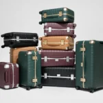The Away Aluminum Edge Collection Reinvents Iconic Cases a stack of luggage on a white background. Away Aluminum Edge Collection. {Tech} for Travel. https://techfortravel.co.uk