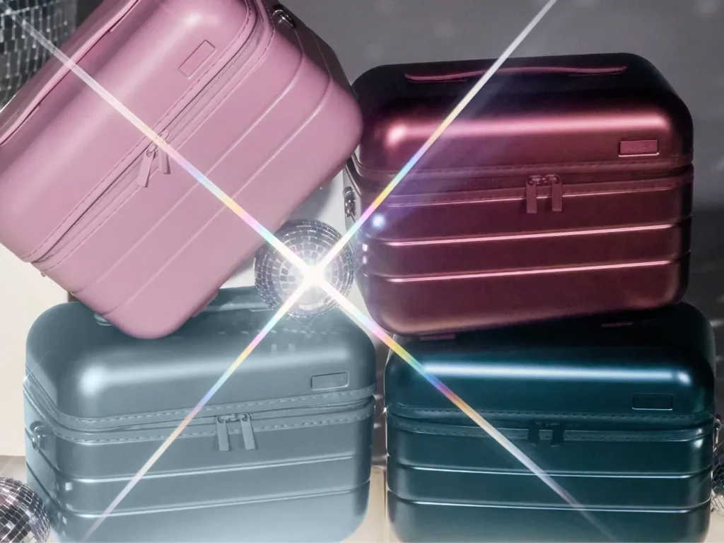 Away Metallic Collection Lifestyle – {Tech} for Travel a stack of luggage with a light shining on it. Away Metallic Collection. {Tech} for Travel. https://techfortravel.co.uk