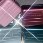 Seasonal Away Metallic Collection Limited Edition goes Festive a stack of luggage with a light shining on it. Away Metallic Collection. {Tech} for Travel. https://techfortravel.co.uk