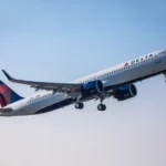 Delta Air Line A321 Neo – {Tech} for Travel a plane flying in the sky. Fly Delta App. {Tech} for Travel. https://techfortravel.co.uk