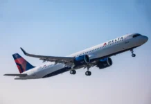 Delta App 7.5 Enhances Travel Experience Ahead of Holiday Season a plane flying in the sky. Fly Delta App. {Tech} for Travel. https://techfortravel.co.uk