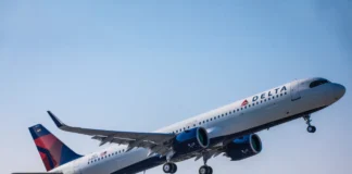 Delta App 7.5 Enhances Travel Experience Ahead of Holiday Season a plane flying in the sky. Fly Delta App. {Tech} for Travel. https://techfortravel.co.uk
