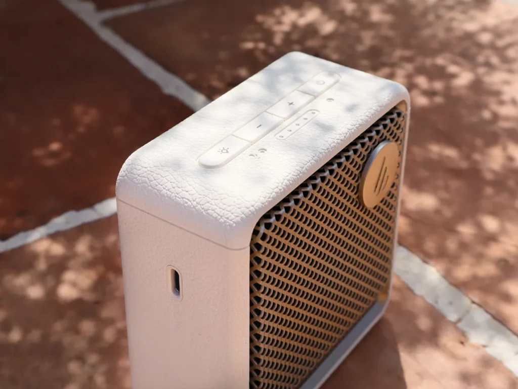 Edifier ES20 Speaker Review Buttons – {Tech} for Travel a white square speaker on a brick surface. Edifier ES20 Speaker Review. {Tech} for Travel. https://techfortravel.co.uk
