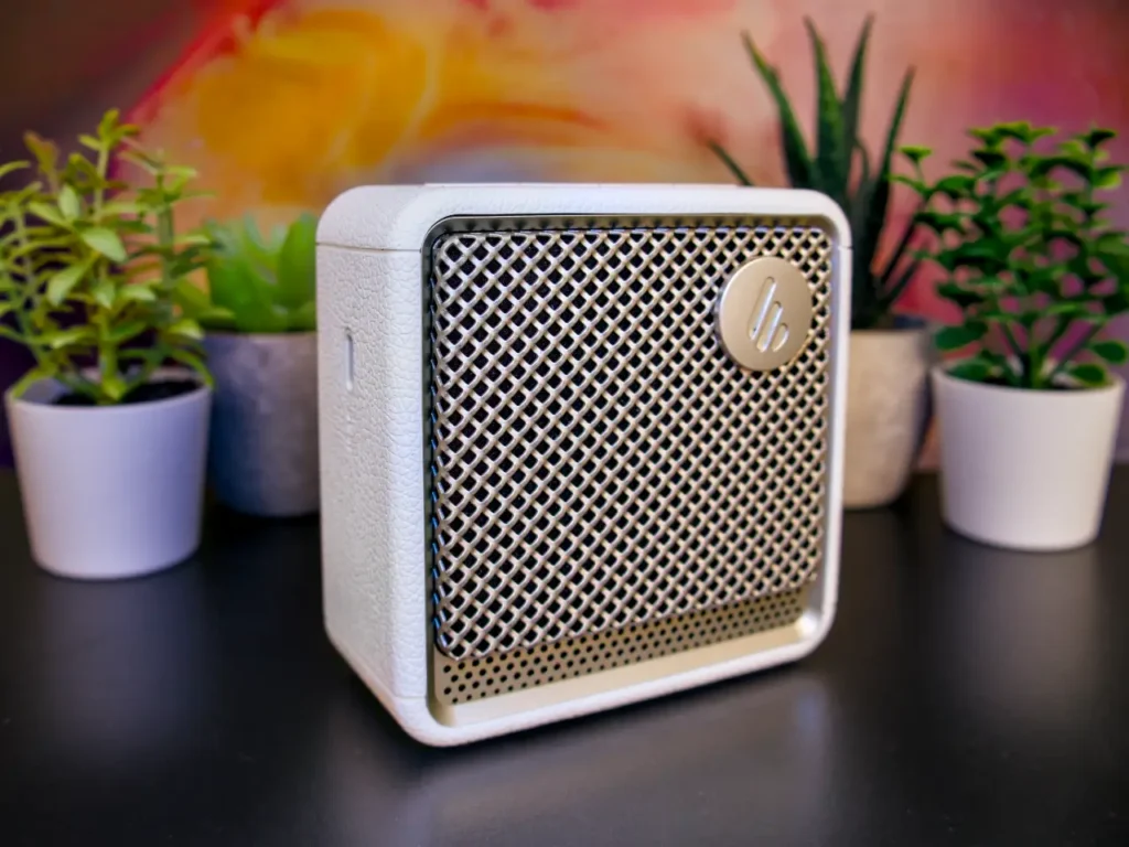 Edifier ES20 Speaker Review Hero – {Tech} for Travel a white square speaker with a silver circle on top of it. Edifier ES20 Speaker Review. {Tech} for Travel. https://techfortravel.co.uk