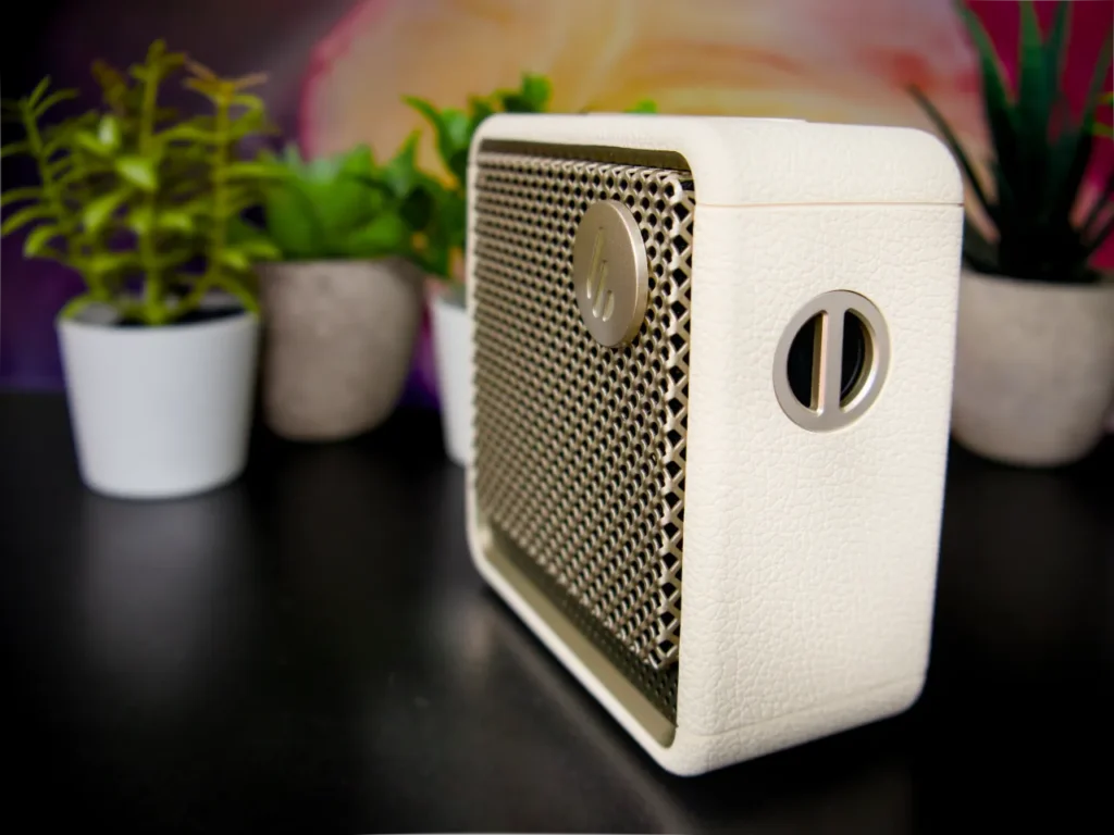 Edifier ES20 Speaker Review Side – {Tech} for Travel a white speaker on a table. Edifier ES20 Speaker Review. {Tech} for Travel. https://techfortravel.co.uk
