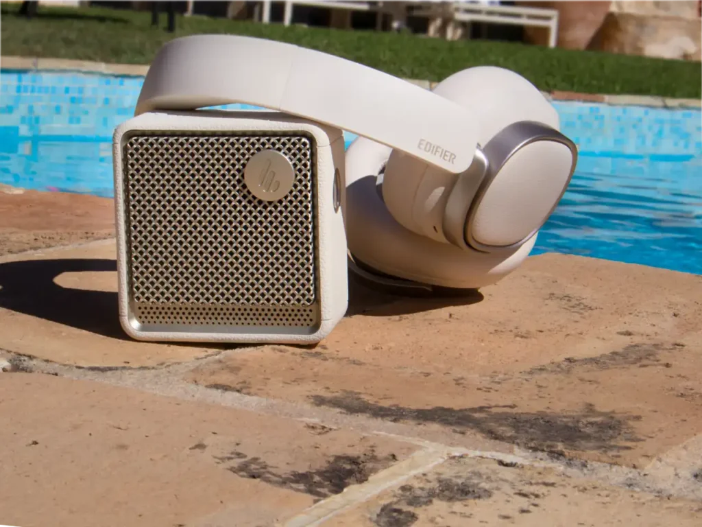 Edifier ES20 Speaker Review with ES Headphones – {Tech} for Travel a white headphones on a brick surface. Edifier ES20 Speaker Review. {Tech} for Travel. https://techfortravel.co.uk