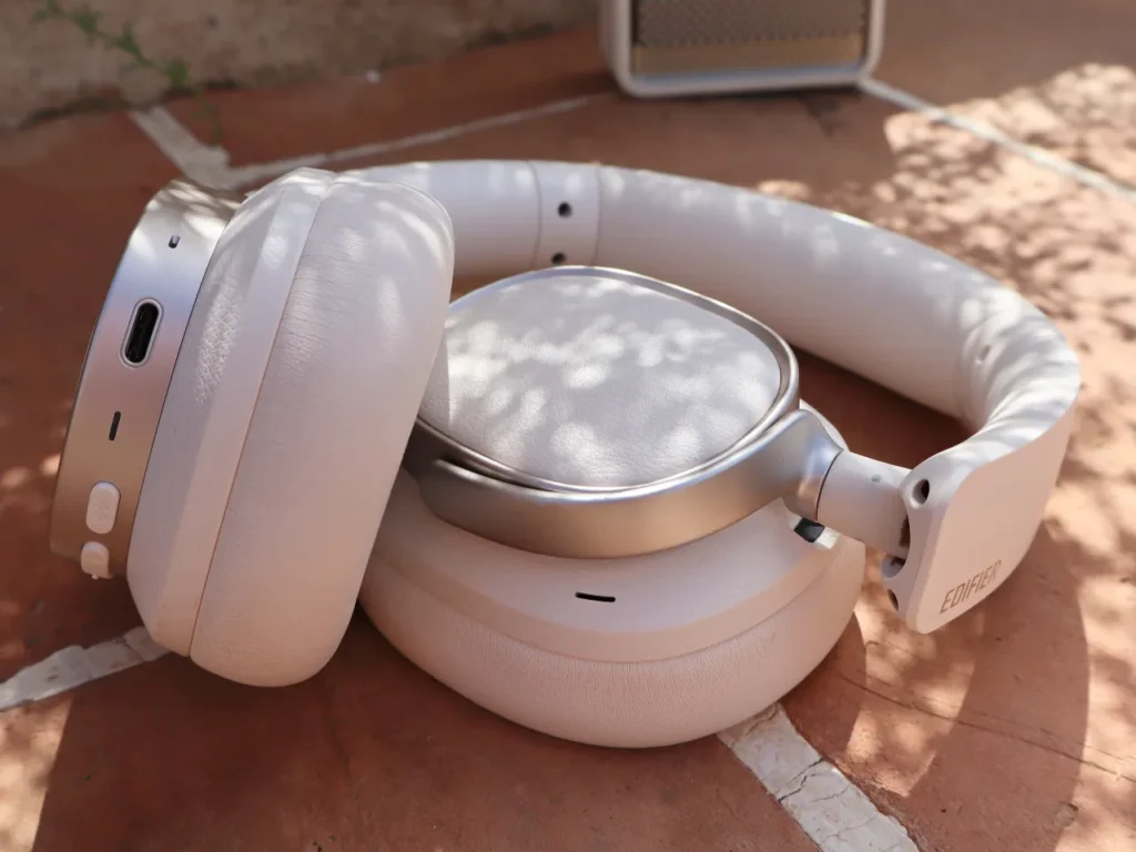 a pair of white headphones on a red surface. Edifier ES850NB Headphones Review. {Tech} for Travel. https://techfortravel.co.uk