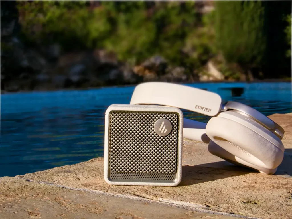 a white headphones next to a speaker. Edifier ES850NB Headphones Review. {Tech} for Travel. https://techfortravel.co.uk