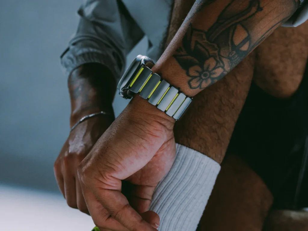 a person with tattoos on their arm. Nomad Stratos Apple Watch Band. {Tech} for Travel. https://techfortravel.co.uk