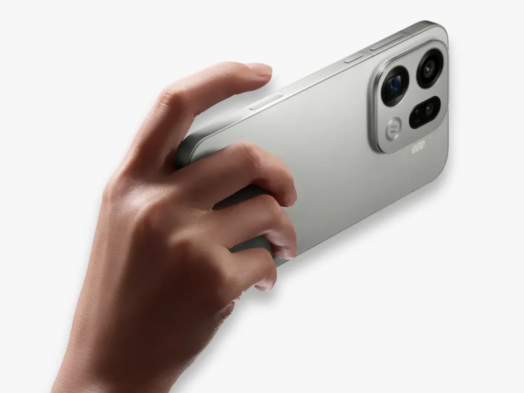 a hand holding a silver cell phone. OPPO Find X9 Series. {Tech} for Travel. https://techfortravel.co.uk