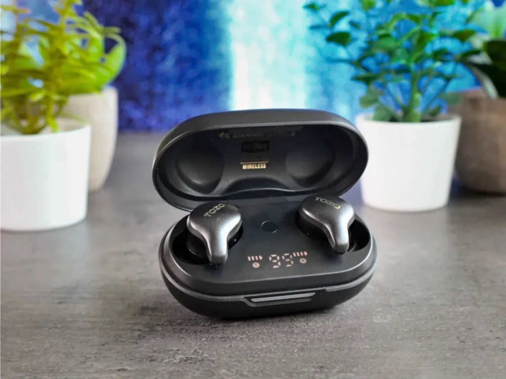 TOZO Golden X1 Earbuds Case Open – {Tech} for Travel a black wireless earbuds in a case. TOZO Golden X1 Review. {Tech} for Travel. https://techfortravel.co.uk