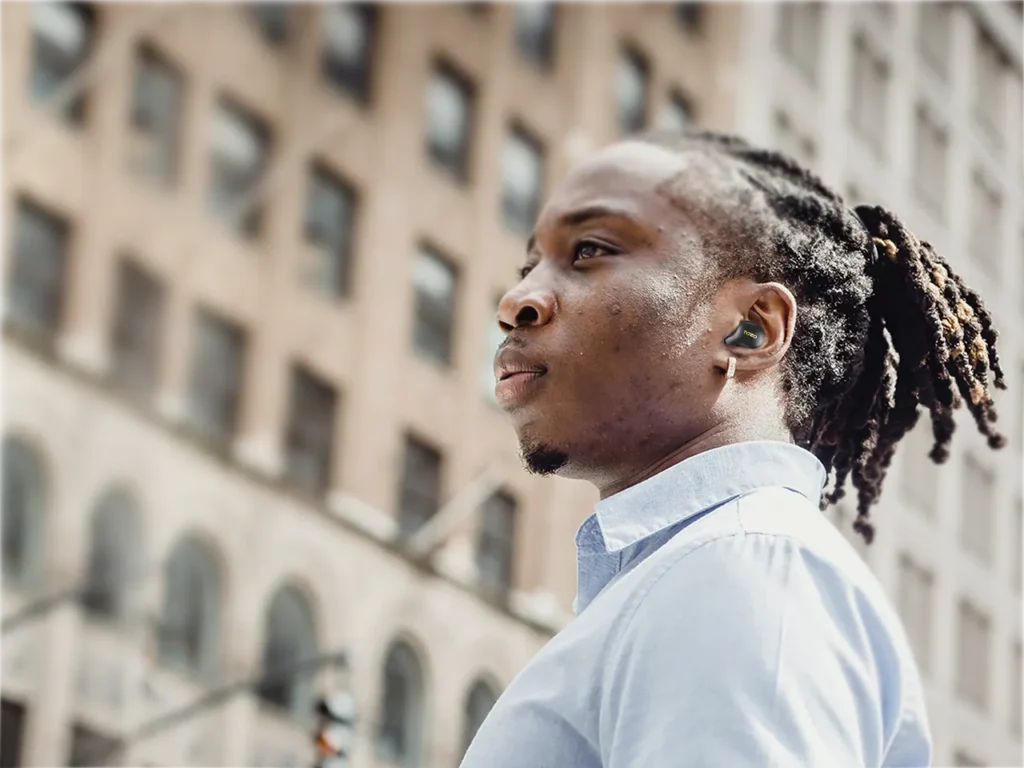 TOZO Golden X1 Earbuds Lifestyle – {Tech} for Travel a man in a blue shirt. TOZO Golden X1 Review. {Tech} for Travel. https://techfortravel.co.uk