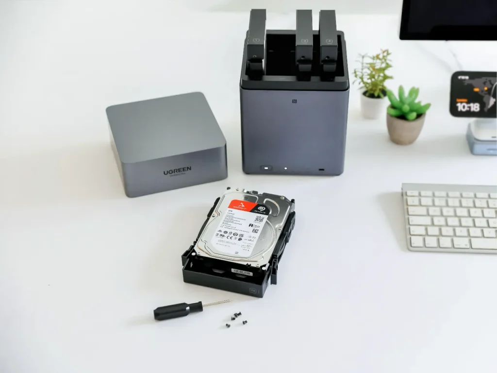 UGREEN DH4300 Plus HDD removal – {Tech} for Travel a computer hard drive and a keyboard. UGREEN NASync DH4300 Plus Review. {Tech} for Travel. https://techfortravel.co.uk