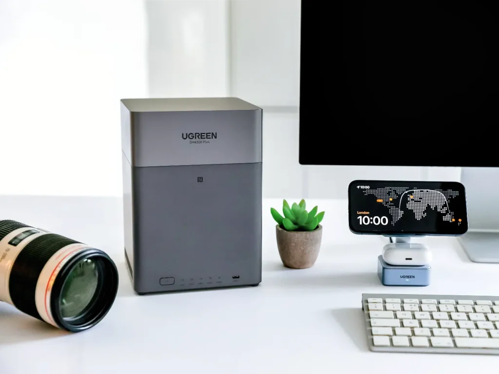 UGREEN DH4300 Plus Lifestyle 1 – {Tech} for Travel a computer monitor and camera on a desk. UGREEN NASync DH4300 Plus Review. {Tech} for Travel. https://techfortravel.co.uk