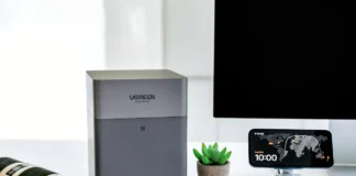 UGREEN NASync DH4300 Plus Review: The Traveller’s Personal Cloud Companion a computer monitor and camera on a desk. UGREEN NASync DH4300 Plus Review. {Tech} for Travel. https://techfortravel.co.uk
