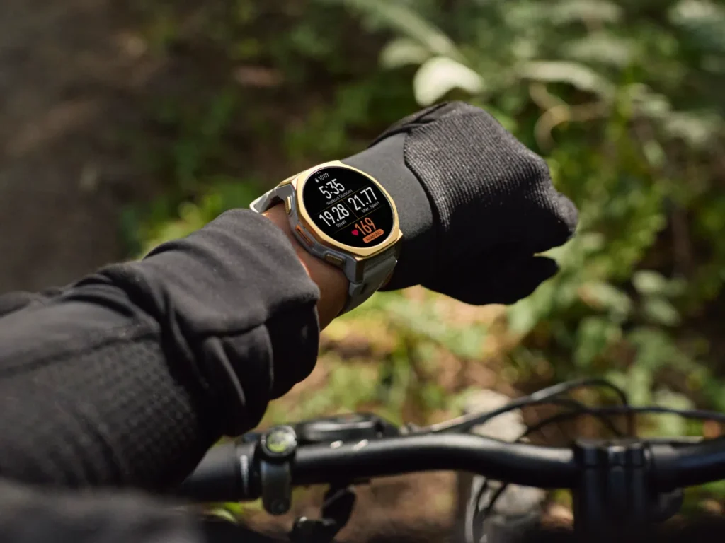 Amazfit TRex 3 Pro – {Tech} for Travel a person wearing a watch on a bicycle. best travel gifts for Christmas 2025. {Tech} for Travel. https://techfortravel.co.uk