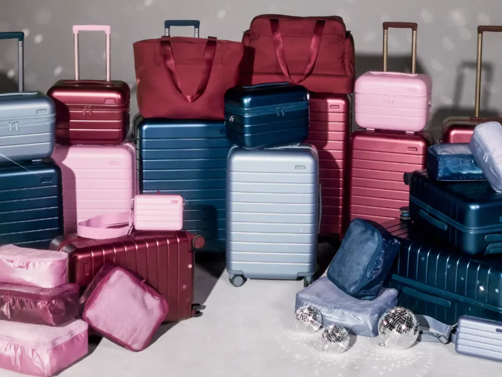 Away Mettalic Collection – {Tech} for Travel a group of luggage on a white floor. Away Metallic Collection. {Tech} for Travel. https://techfortravel.co.uk