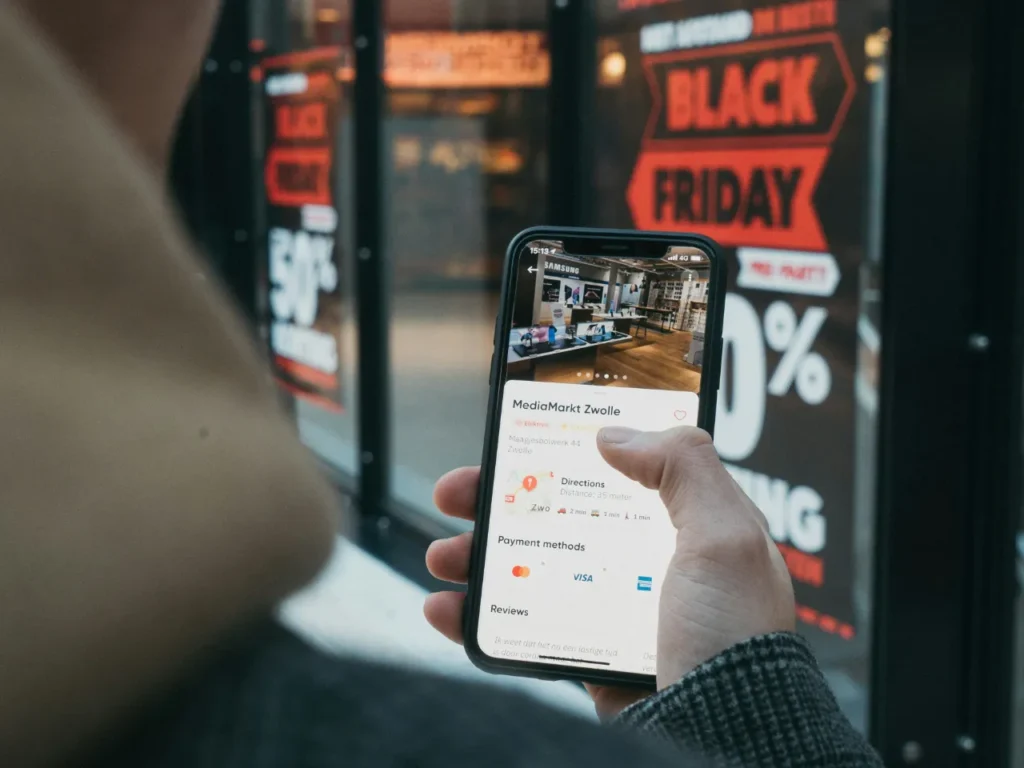 Black Friday Cyber Monday – {Tech} for Travel a person holding a cell phone. Black Friday. Cyber Monday deal. {Tech} for Travel. https://techfortravel.co.uk