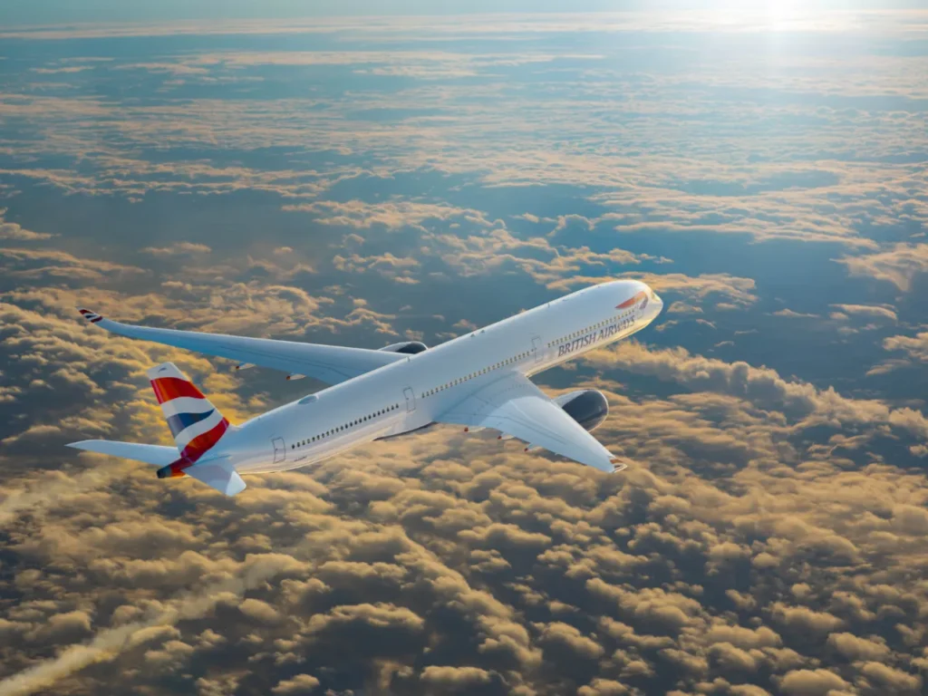 an airplane flying above clouds. British Airways Wi-Fi. {Tech} for Travel. https://techfortravel.co.uk