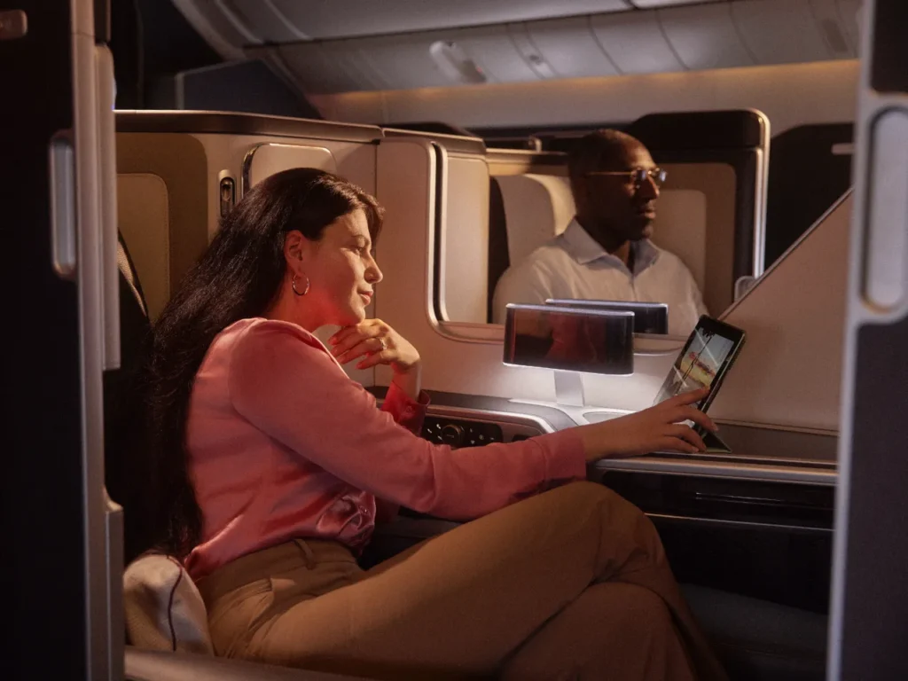 a woman sitting in a chair with a tablet on her lap. British Airways Wi-Fi. {Tech} for Travel. https://techfortravel.co.uk