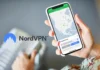 Black Friday Deals 2025: NordVPN Drops Prices by Up to 77% on 2-Year Plans a hand holding a phone. NordVPN Black Friday 2025. {Tech} for Travel. https://techfortravel.co.uk