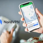Black Friday Deals 2025: NordVPN Drops Prices by Up to 77% on 2-Year Plans a hand holding a phone. NordVPN Black Friday 2025. {Tech} for Travel. https://techfortravel.co.uk