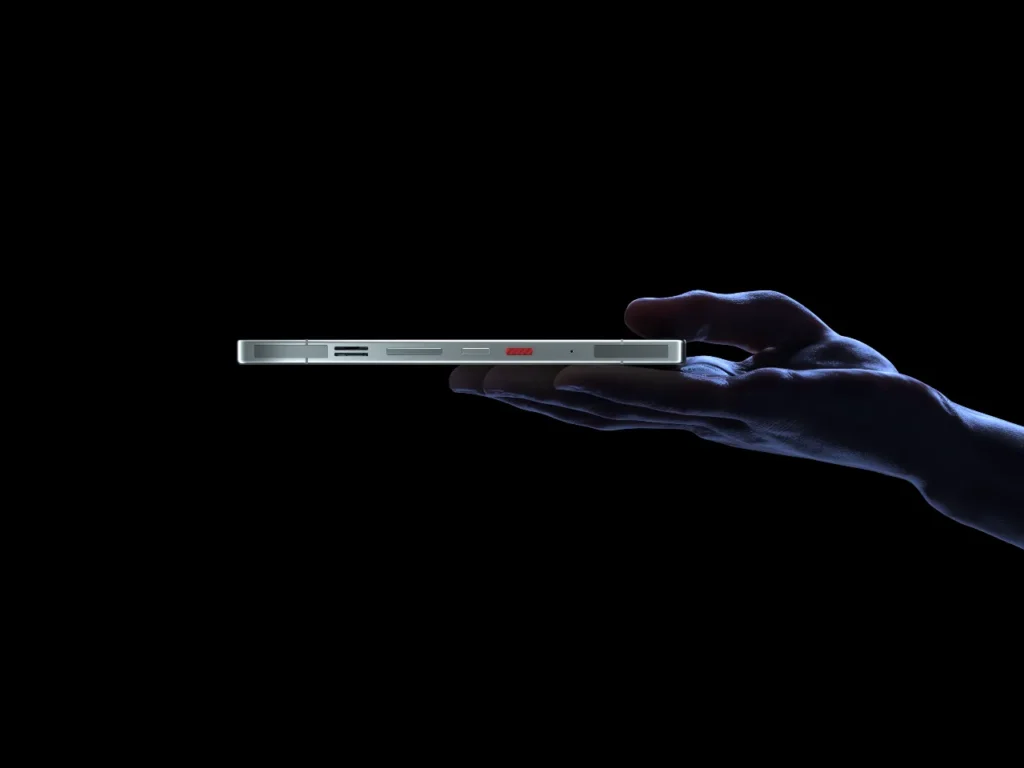 REDMAGIC 11 Pro White side – {Tech} for Travel a hand holding a cell phone. REDMAGIC 11 Pro. {Tech} for Travel. https://techfortravel.co.uk