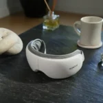 a white headphones on a table. Black Friday Deals 2025