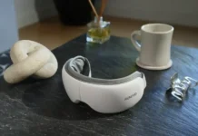 Black Friday Deals 2025: Travel-Friendly Self-Care Tech by RENPHO a white headphones on a table. Black Friday Deals 2025