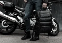 Black Friday Deals 2025: STM Goods takes 40% off everything a person holding a backpack next to a motorcycle. Black Friday Deals 2025