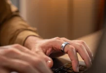 Wearable upgrade Aivela Ring Pro launches with 8 touch and 6 air gestures a person using a laptop. Aivela Ring Pro. CES 2026. {Tech} for Travel. https://techfortravel.co.uk