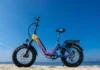 Long-range ebike upgrade Heybike X Series confirms 90-mile range a purple and yellow bike on a beach. Heybike X Series. CES 2026 News. {Tech} for Travel. https://techfortravel.co.uk