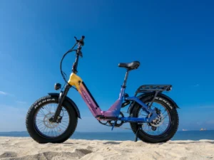 Heybike Ranger 30 Pro beach โ {Tech} for Travel a purple and yellow bike on a beach. Heybike X Series. CES 2026 News. {Tech} for Travel. https://techfortravel.co.uk
